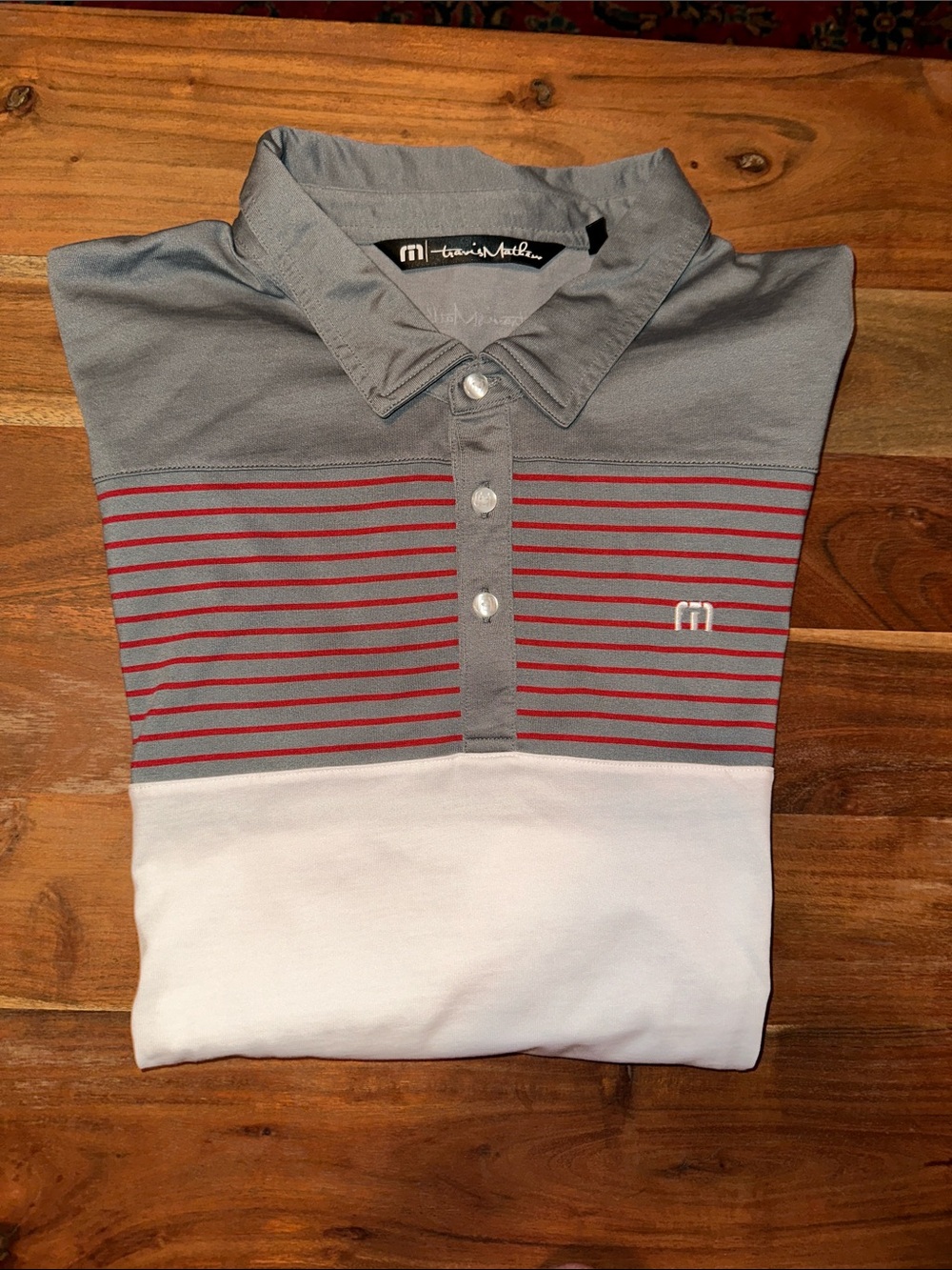 Travis Mathew Gray, White & Red Striped Golf Polo with TPC Sawgrass logo